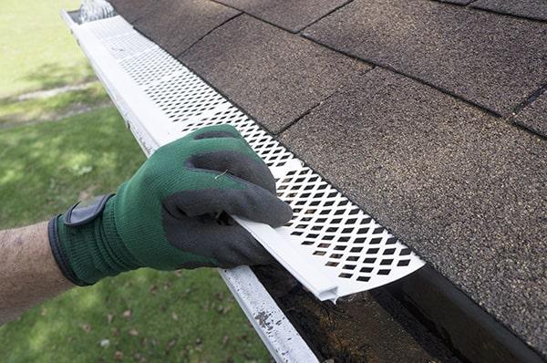 gutter guards work by covering the gutters with a protective mesh or screen to prevent debris from accumulating